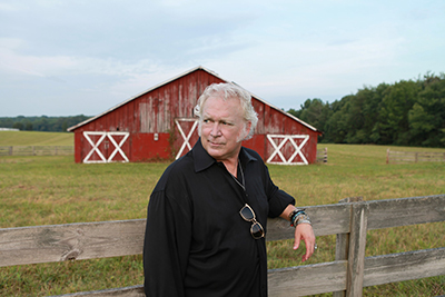 T Graham Brown by barn